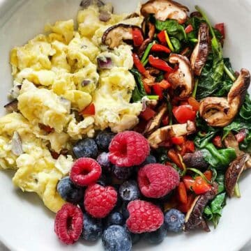 Scrambled eggs, spinach, berries foodiecrush.com