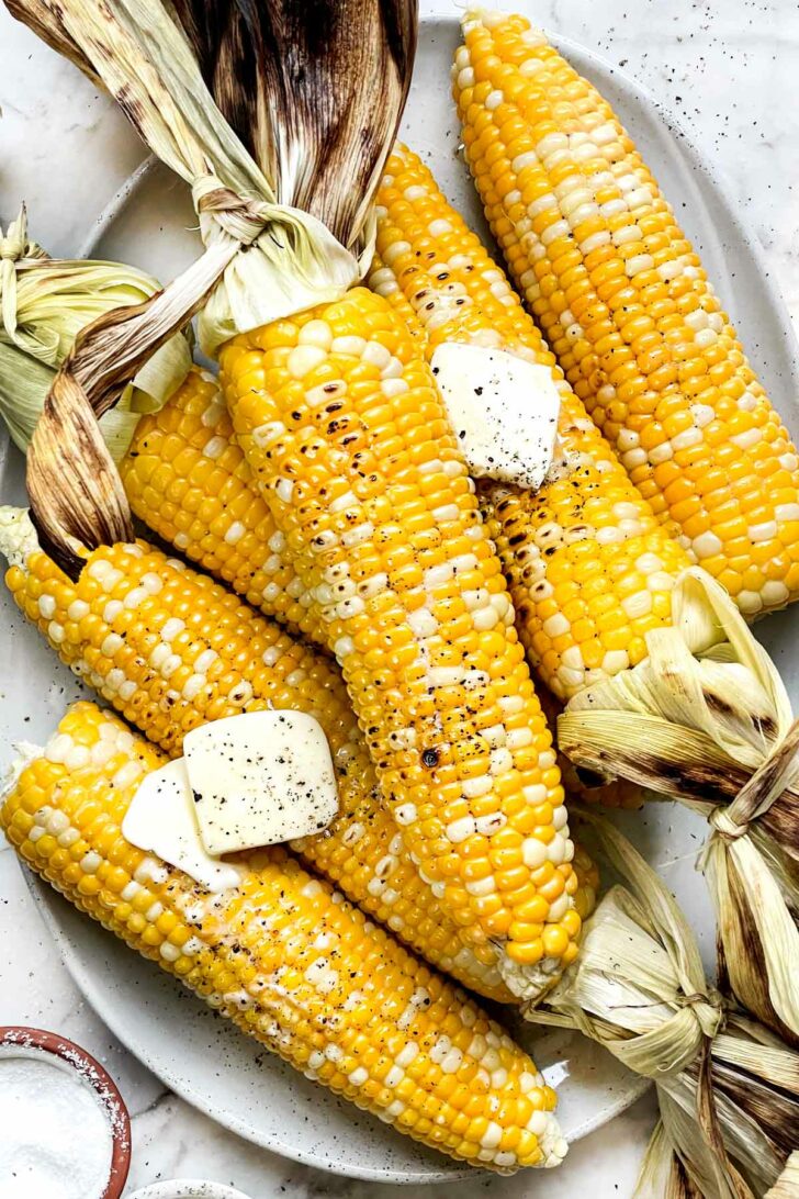 Grilled Corn on the Cob with butter on platter foodiecrush.com