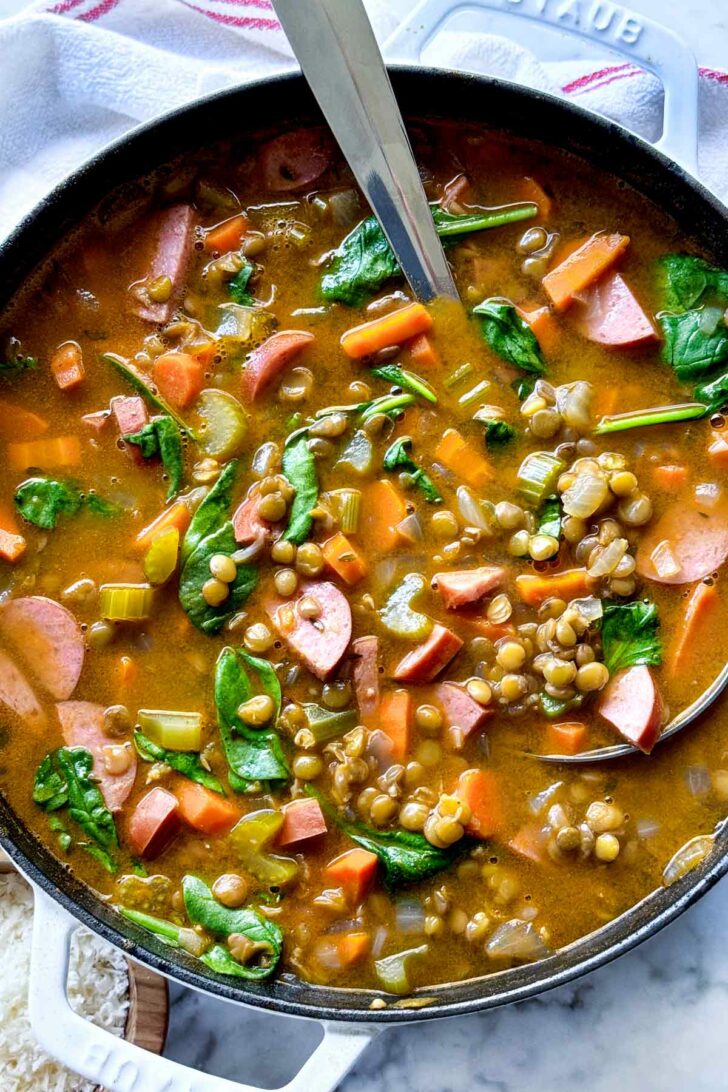 Lentil Soup with ladle in pot foodiecrush.com