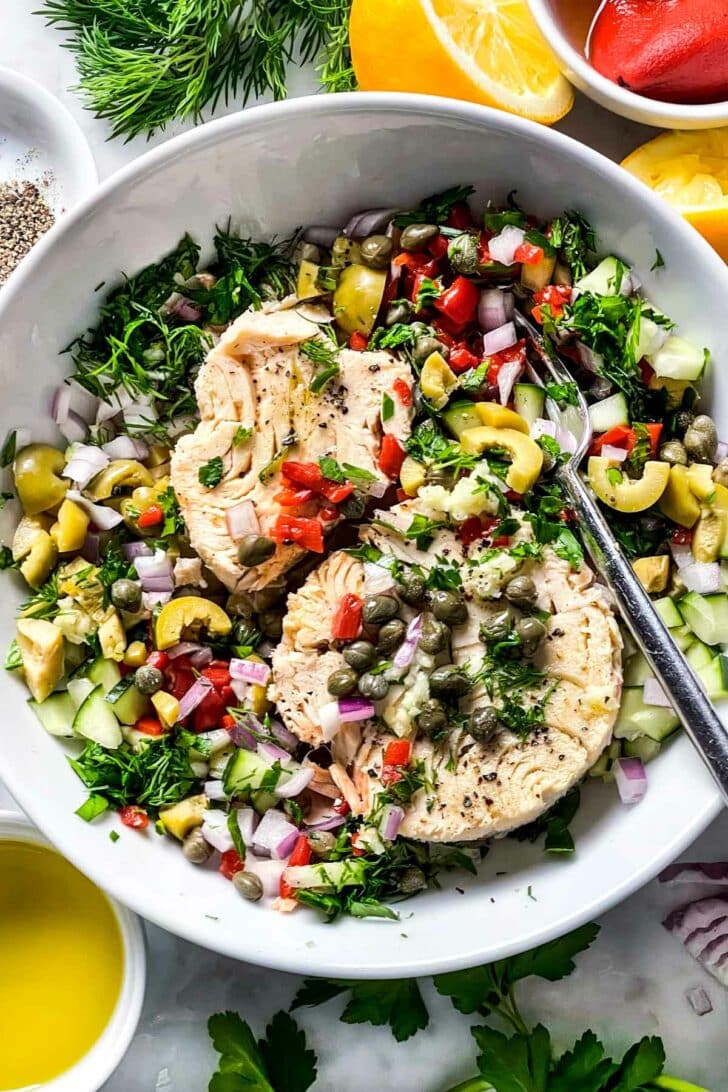 Mediterranean Tuna Salad ingredients in a bowl foodiecrush.com